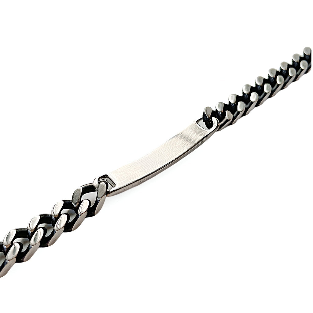 Bracelet gourmette en acier inoxydable argenté à maille cubaine avec plaque personnalisable.