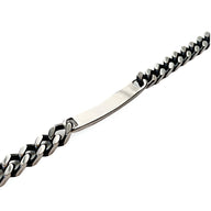 Bracelet gourmette en acier inoxydable argenté à maille cubaine avec plaque personnalisable.