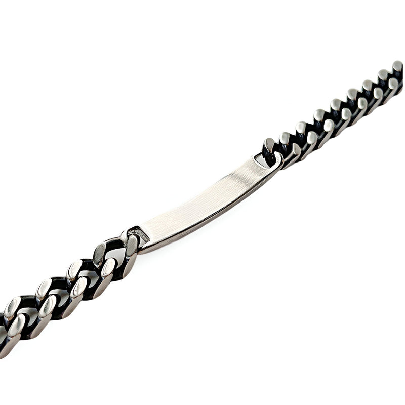 Bracelet gourmette en acier inoxydable argenté à maille cubaine avec plaque personnalisable.