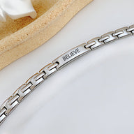 Bracelet gourmette mixte en acier inoxydable couleur argent avec plaque gravée "BELIEVE".