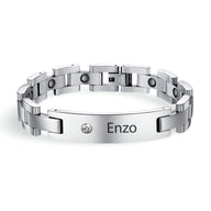 Bracelet magnétique en acier inoxydable argenté, platine et maillons larges, pierre zirconium et gravure Enzo.