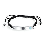 Bracelet cordon noir avec plaque argent personnalisée gravée "Léopold" et pierre zirconium bleue.