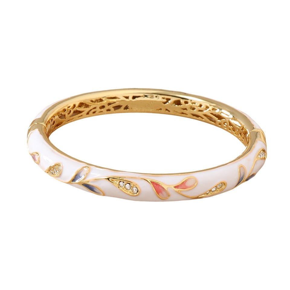 Bracelet jonc en cuivre plaqué or blanc avec motif fleuri coloré et détails scintillants.