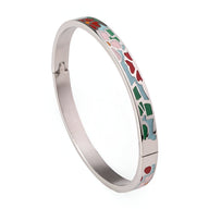 Bracelet jonc en métal argenté avec émail coloré motifs floraux rouge, vert et rose.