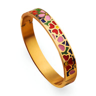 Bracelet jonc doré à motifs floraux émaillés rouges, roses et verts délicats.