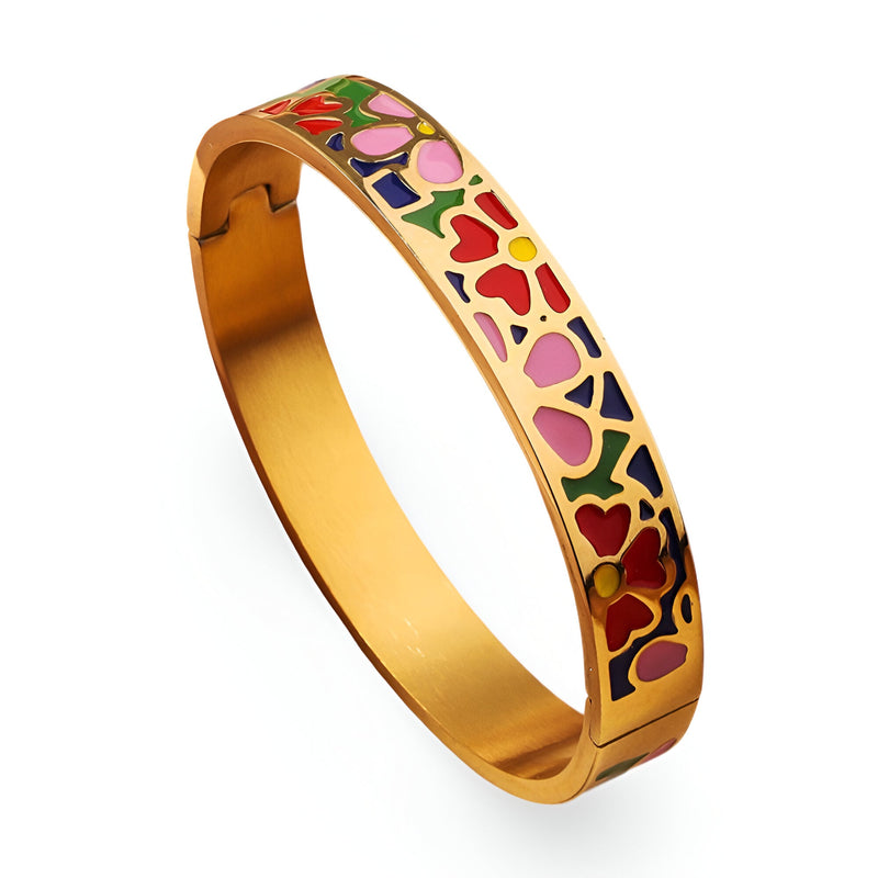 Bracelet jonc doré à motifs floraux émaillés rouges, roses et verts délicats.