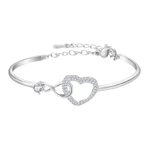 Bracelet jonc en acier inoxydable argenté avec cœur infini pavé de zircons et pierre zircon bleue délicate.
