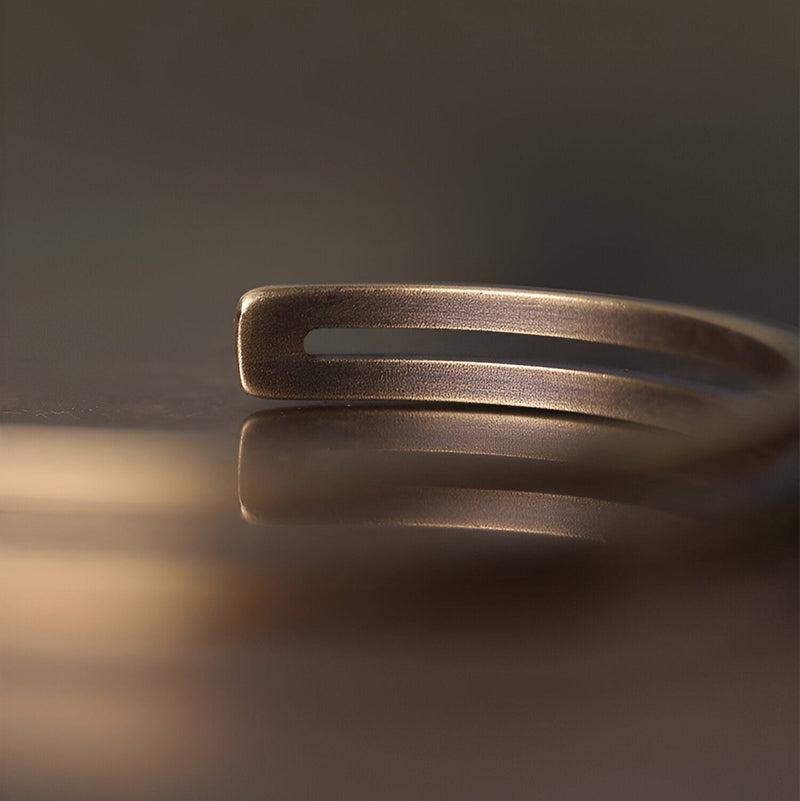 Bracelet jonc double en cuivre or vieux à finition mate et design épuré Artan.