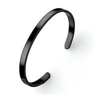 Bracelet jonc en acier inoxydable noir, finition lisse et brillante, style minimaliste pour homme.
