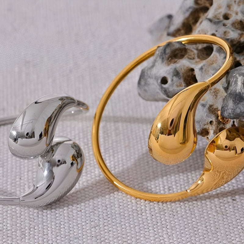 Bracelet jonc doré en acier inoxydable avec extrémités en forme de goutte lisse et brillant, bague argentée assortie aux.