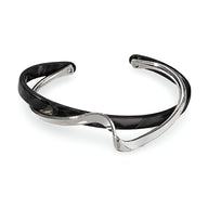 Bracelet jonc femme en acrylique noir marbré et métal argenté au design élégant et moderne.