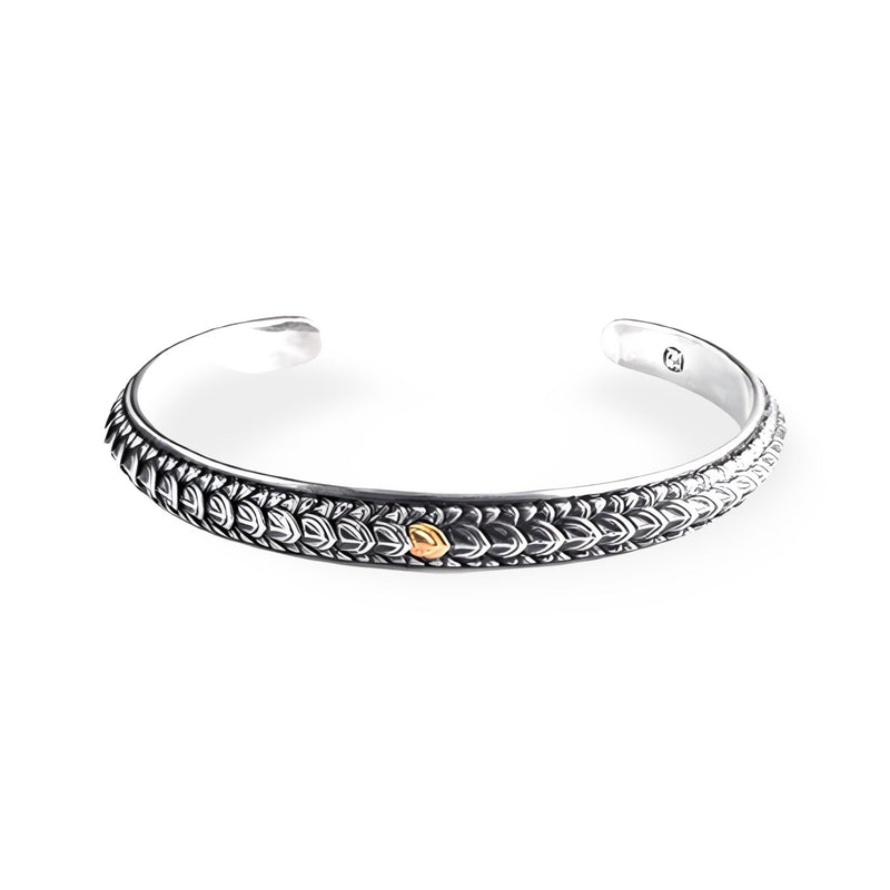Bracelet jonc en cuivre plaqué argent avec motif écailles de dragon et détail doré, style masculin.