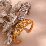 Bracelet jonc en acier inoxydable argenté avec noeud d'agui, modèle Cassiopée et bracelet jonc doré avec noeud d'agui,.