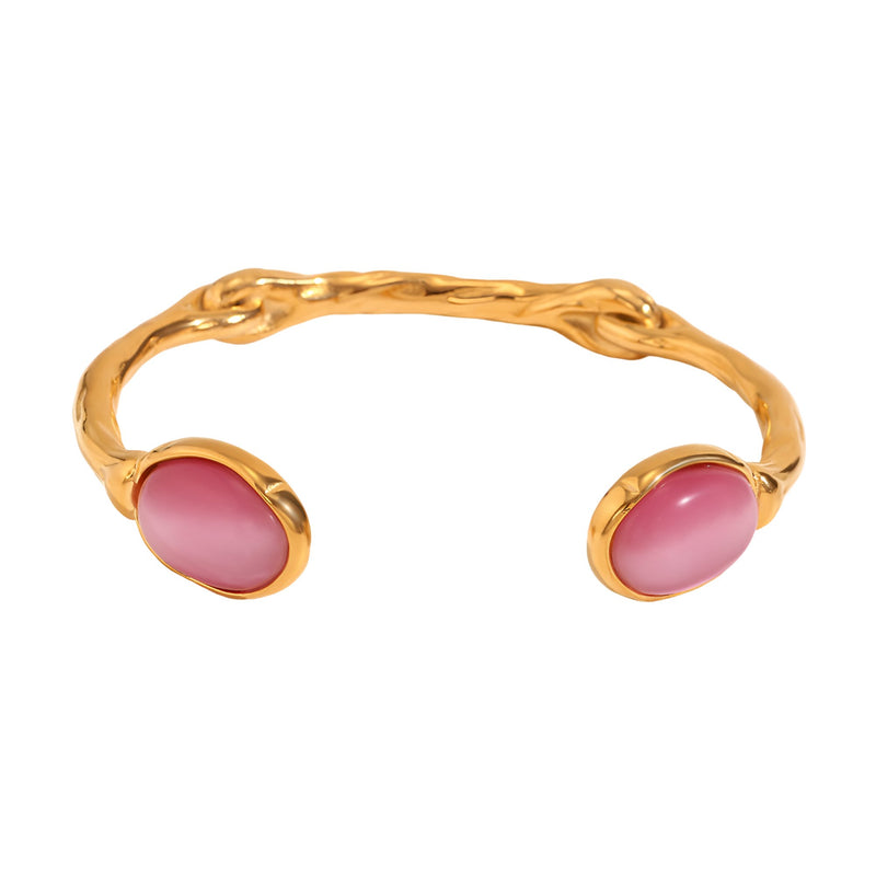 Bracelet jonc en acier doré avec deux perles ovales roses en cristal rose.