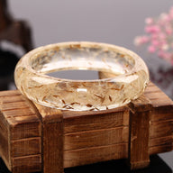 Bracelet jonc en résine, avec fleurs séchées de pissenlit intégrées, modèle Piessa - La Boutique du Bracelet