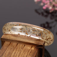 Bracelet jonc en résine, avec fleurs séchées de pissenlit intégrées, modèle Piessa - La Boutique du Bracelet