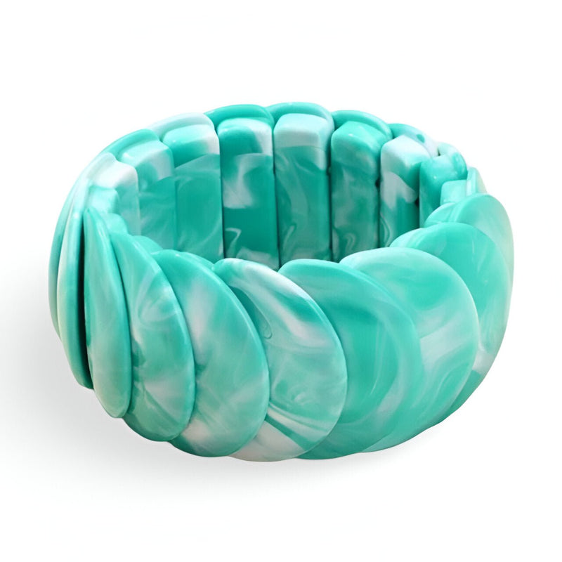 Bracelet jonc épais en acrylique turquoise marbré au fini brillant.