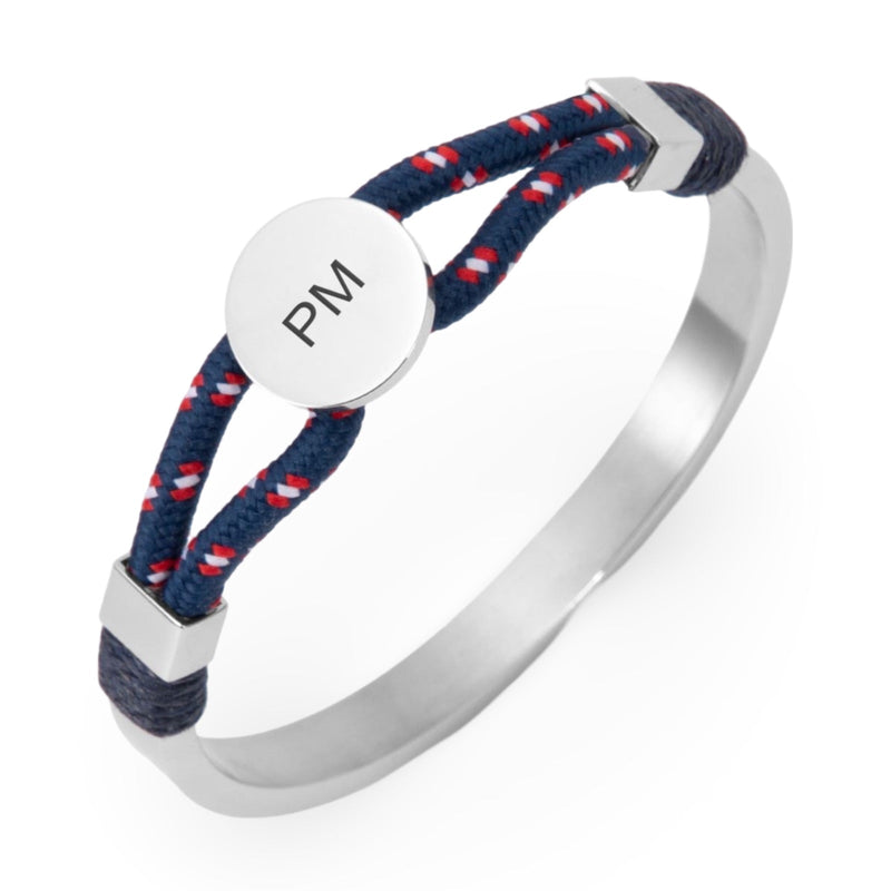 Bracelet jonc argent avec cordon bleu marine à motifs rouges et médaillon central gravé PM.