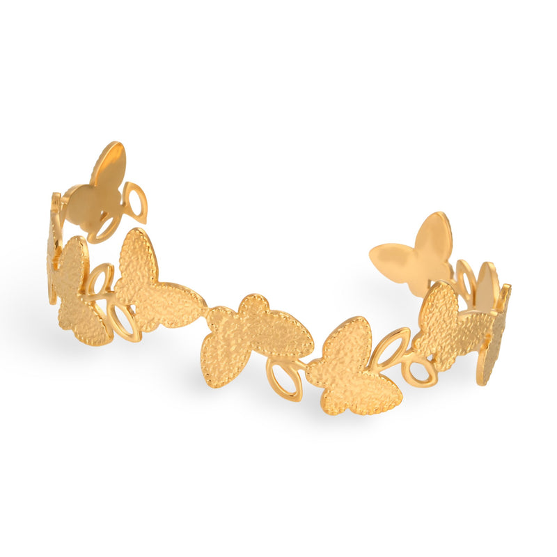 Bracelet jonc or en acier inoxydable avec motifs floraux et papillons ajourés.