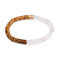 Bracelet jonc mixant acrylique transparent et motifs léopard orange et noir avec jonction dorée.