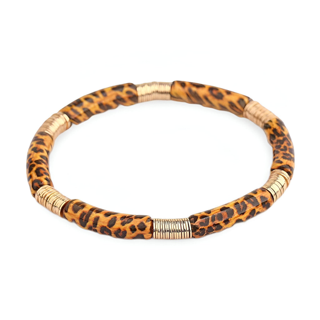 Bracelet jonc fin en acrylique imprimé léopard avec empiècements dorés élégants.