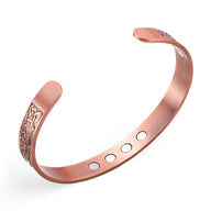 Bracelet jonc magnétique en cuivre bronze pour homme avec motifs gravés et aimants visibles intérieur.