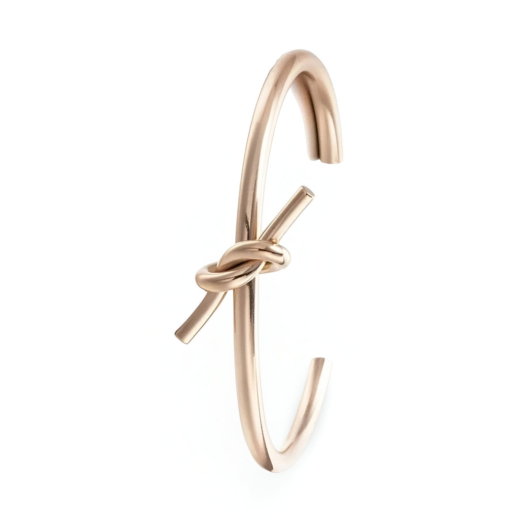 Bracelet jonc en acier inoxydable or rosé avec nœud élégant pour femme modèle Méli.