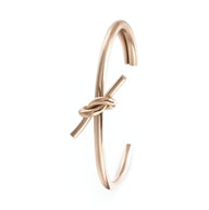 Bracelet jonc en acier inoxydable or rosé avec nœud élégant pour femme modèle Méli.