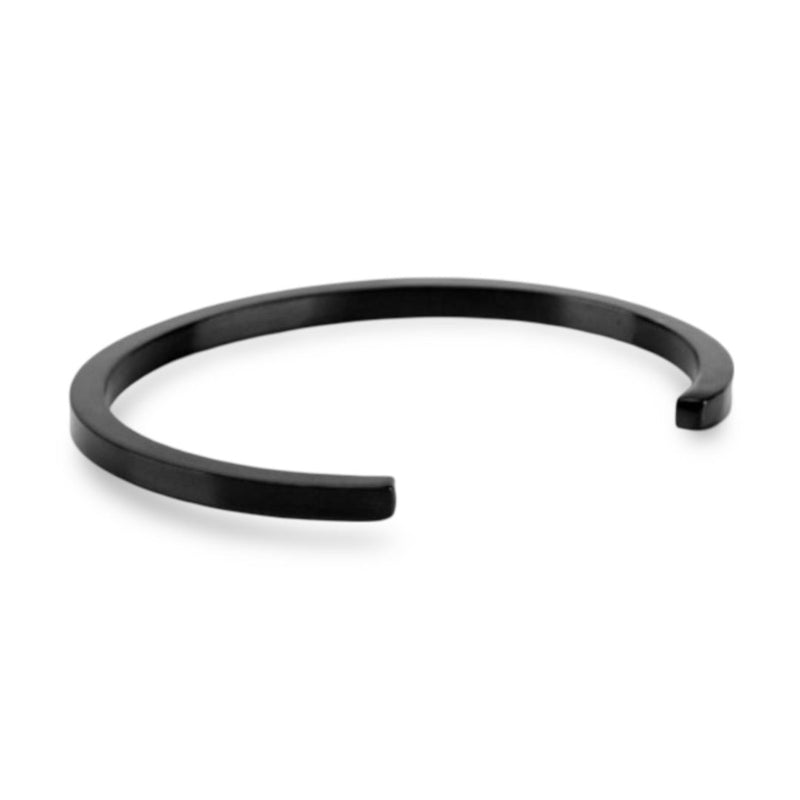 Bracelet jonc ouvert en acier inoxydable noir, finition mate, design minimaliste et unisexe.