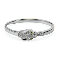 Bracelet jonc argenté orné d'une tête de léopard pavée de cristaux avec yeux verts éclatants.