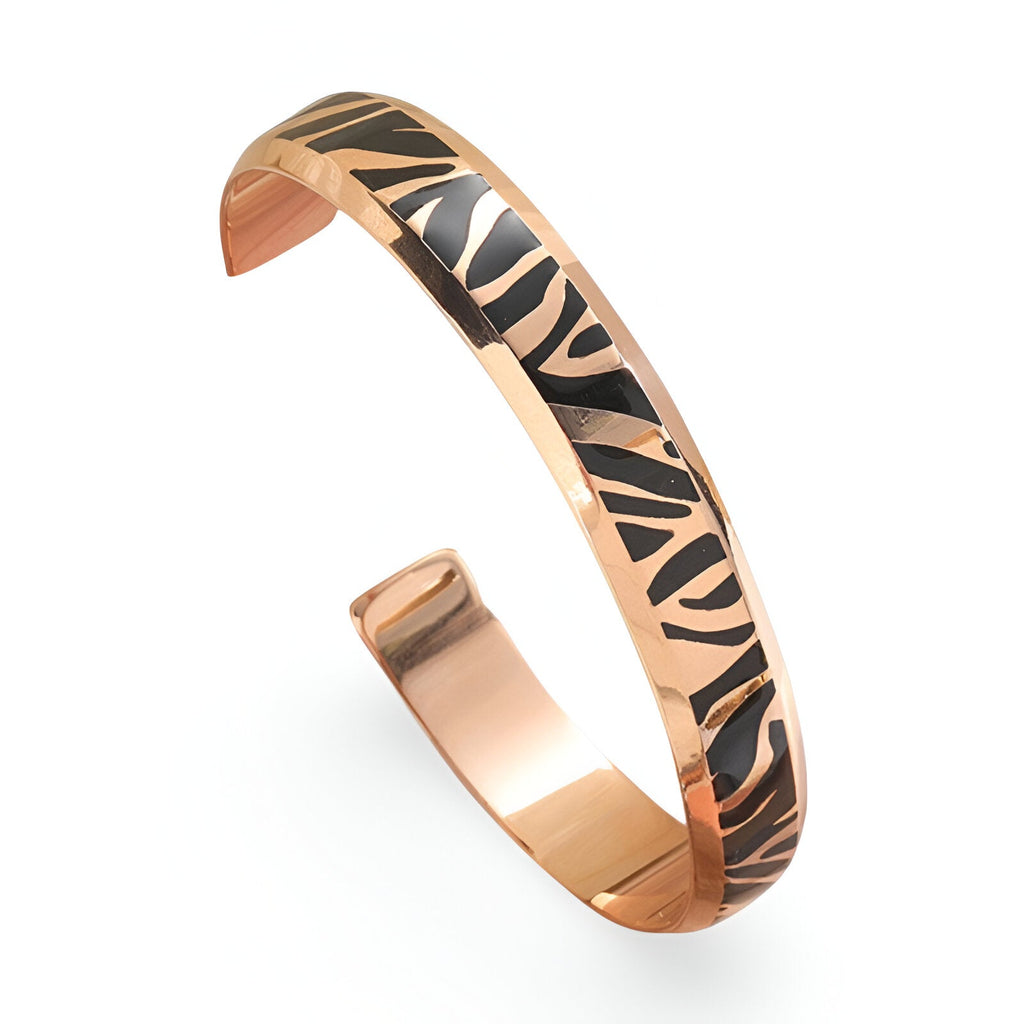 Bracelet jonc en titane or rosé avec motif tigré noir pour femme, finition lisse.