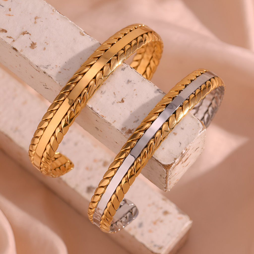 Bracelet jonc tressé en acier inoxydable plaqué or jaune et argent, design délicat et élégant.
