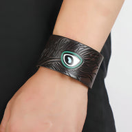 Bracelet large en cuir marron avec motif œil floral turquoise et noir, modèle Faron.