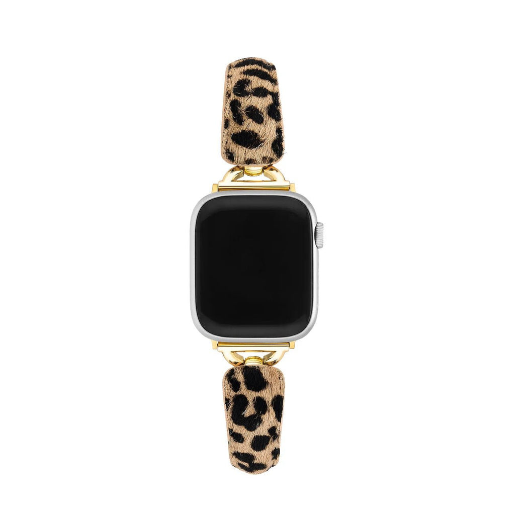 Bracelet pour Apple Watch avec motif léopard beige et noir, finitions dorées brillantes, texture effet poils fine et.
