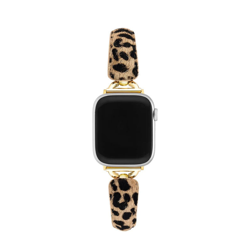 Bracelet pour Apple Watch avec motif léopard beige et noir, finitions dorées brillantes, texture effet poils fine et.