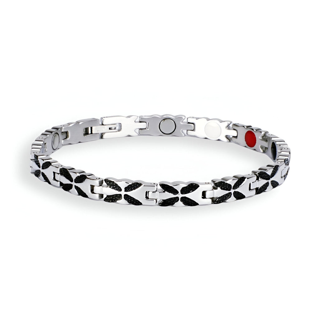 Bracelet magnétique en titane argenté avec détails en forme de croix noire, pour femme, modèle Aslaug.