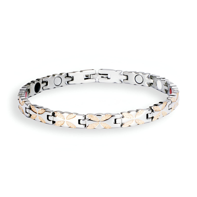 Bracelet magnétique en titane pour femme, design argenté avec motifs croisés or rosé, finition lisse.