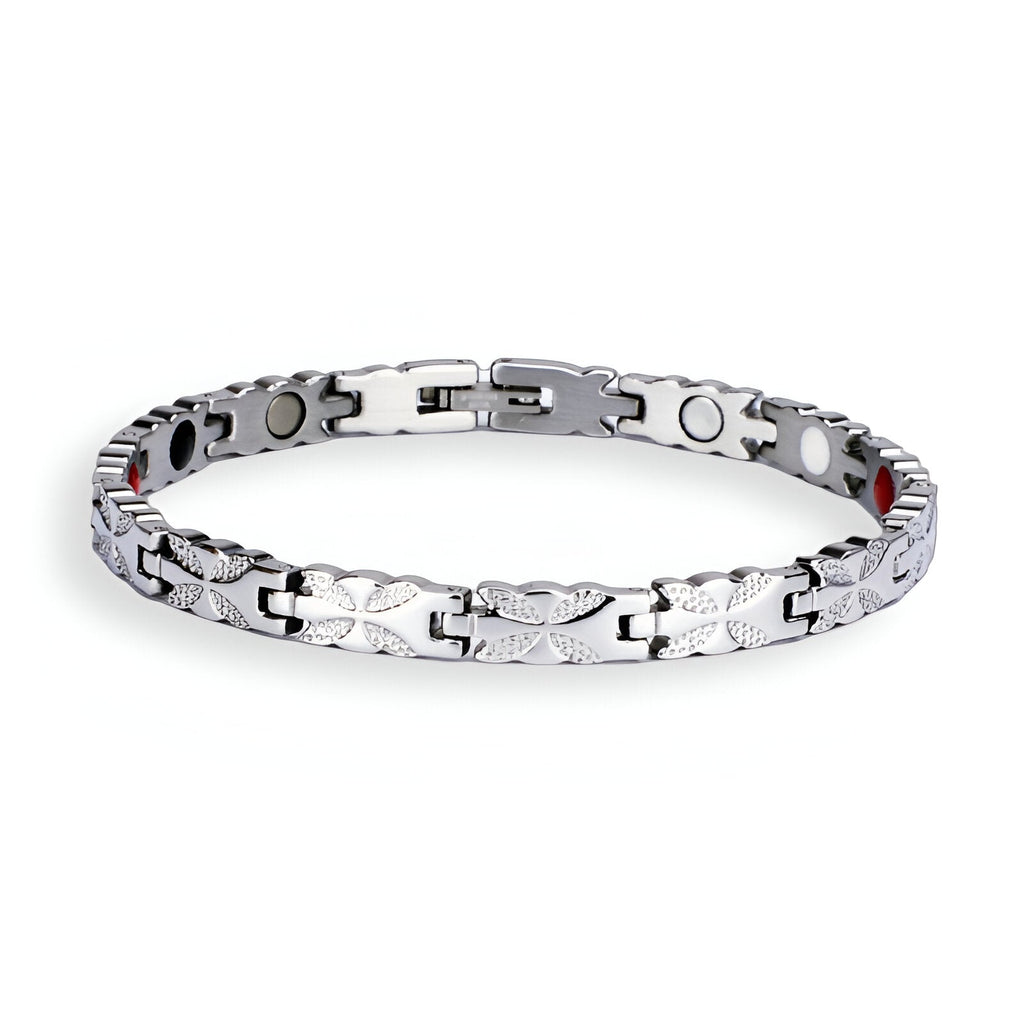 Bracelet femme magnétique en titane argenté avec maillons fins et plaques circulaires noires.