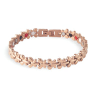 Bracelet magnétique Idunn en acier inoxydable or rosé avec maillons en forme de trèfle.