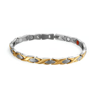 Bracelet mixte en titane argenté et or avec maillons incurvés et aimants visibles.