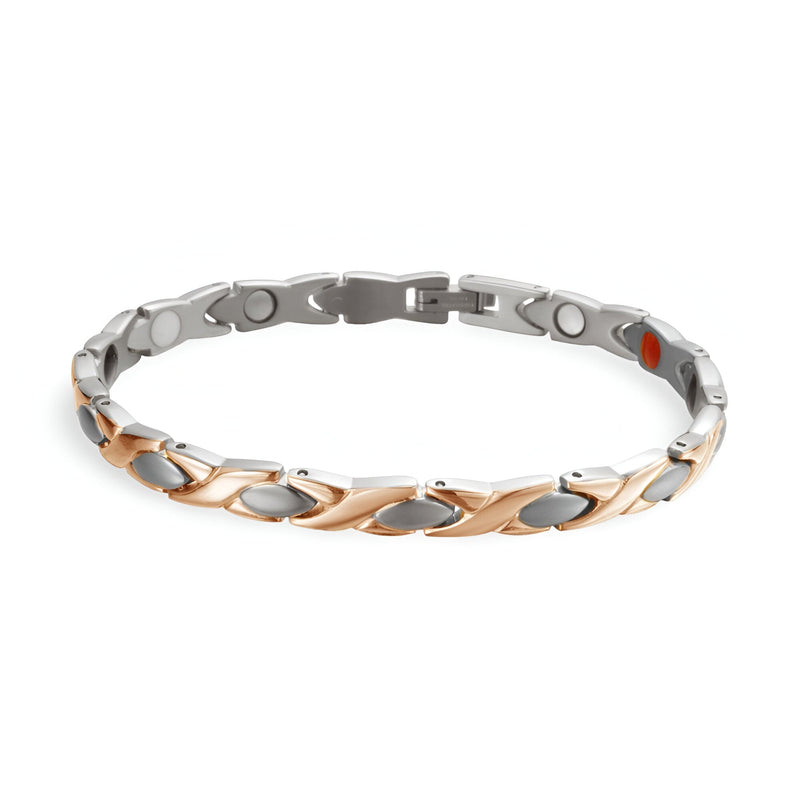 Bracelet femme en titane argent et or rosé avec liens en forme de feuilles et aimants visibles.