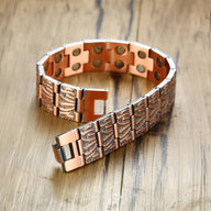 Bracelet magnétique homme en cuivre bronze avec motifs antiques gravés et fermeture ajustable.