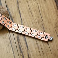 Bracelet magnétique en cuivre bronze avec motifs antiques carrés et pastilles métalliques, pour homme.