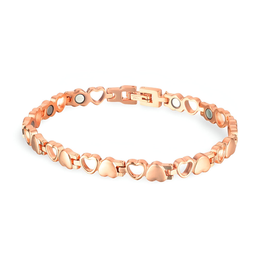 Bracelet magnétique en titane or rosé avec maillons en forme de cœurs et ronds.