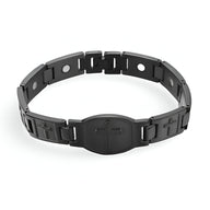 Bracelet magnétique homme en titane noir avec croix chrétienne gravée et maillons larges.