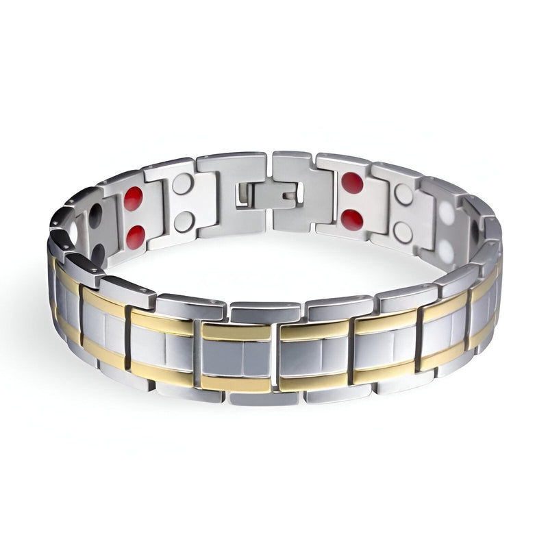 Bracelet magnétique homme en acier inoxydable argenté avec détails dorés et aimants rouges visibles.