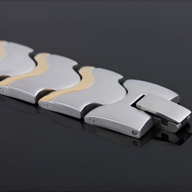 Bracelet magnétique homme en acier inoxydable argent et or, design moderne et géométrique.