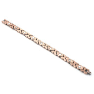 Bracelet magnétique en cuivre bronze pour femme avec maillons hexagonaux et inserts ronds noirs.