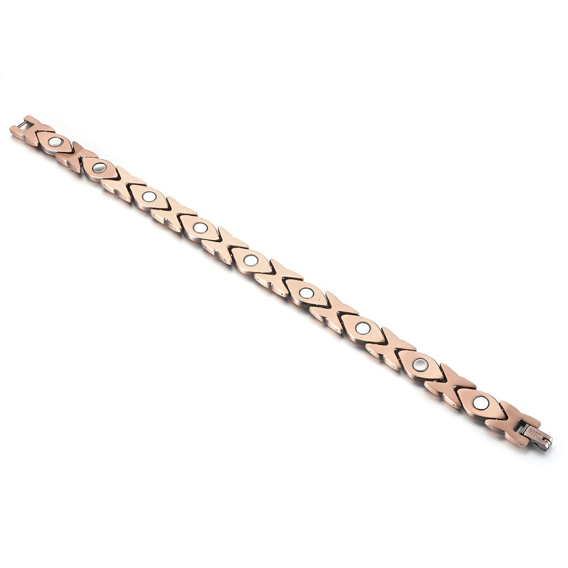 Bracelet magnétique en cuivre bronze pour femme avec maillons hexagonaux et inserts ronds noirs.