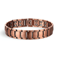 Bracelet magnétique en cuivre couleur bronze avec maillons larges et aimants noirs visibles.
